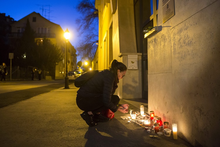 Hungarians pay tribute to the victims in front of the Belgian Embassy in Budapest