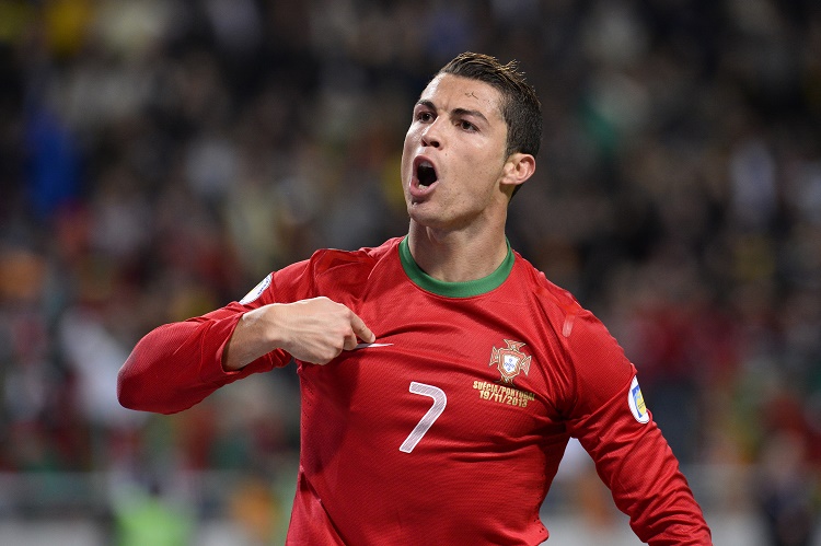 Portugal's forward Cristiano Ronaldo celebrates after scoring the second goal for Portugal during the FIFA 2014 World Cup playoff football match Sweden vs Portugal at the Friends Arena in Solna near Stockholm on November 19, 2013 . AFP PHOTO/ JONATHAN NACKSTRAND (Photo credit should read JONATHAN NACKSTRAND/AFP/Getty Images)